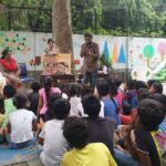 Mottainai Caravan - Library on Wheels' travelling to different locations for conducting Storytelling sessions through the 'Picture Book' and promoting reading habits among children